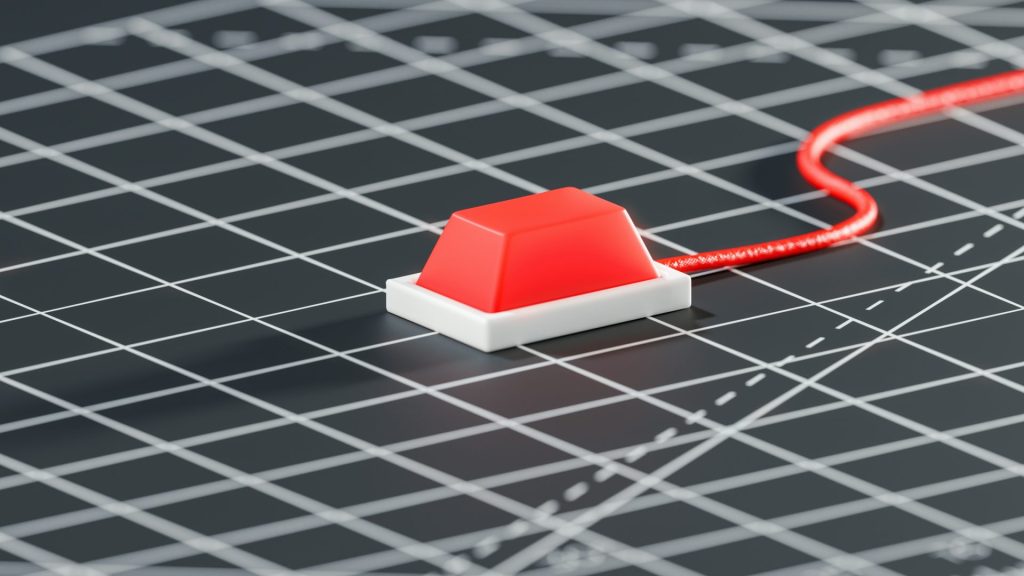 una casa roja y blanca en un papel cuadriculado